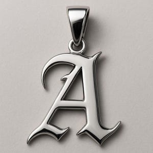May include: A silver pendant featuring the letter "A" in an Old English style. The pendant has a loop for a chain. The background is a plain grey colour.