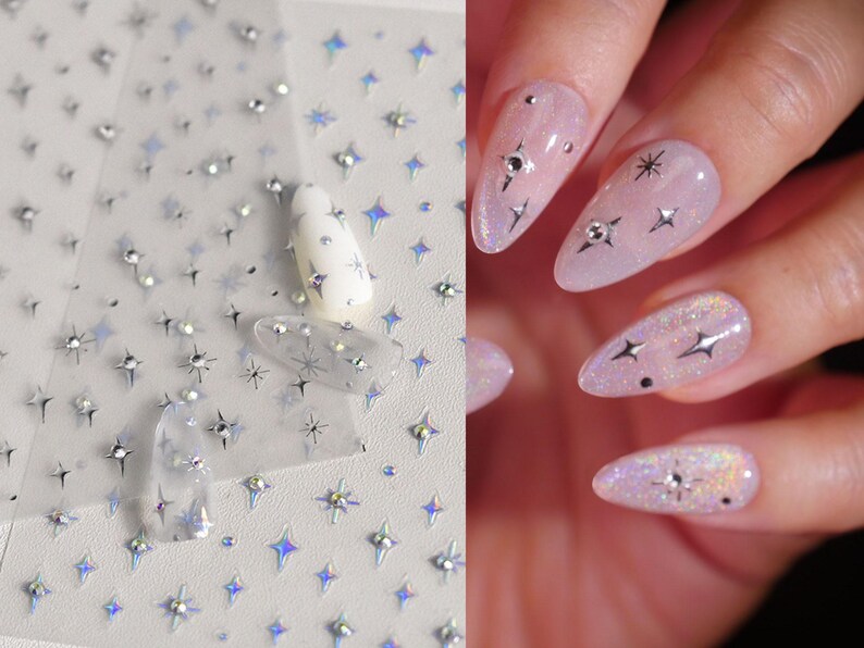 May include: A sheet of nail art stickers with holographic star designs. The stickers are shown applied to a set of nude-colored nails.
