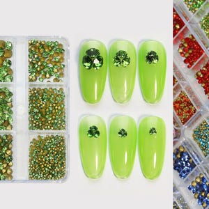 May include: A clear plastic container with 9 compartments filled with green and gold nail rhinestones. There are also 5 green nail tips with green shamrock designs.