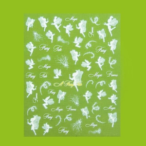 Könnte beinhalten: Bogen mit Nagelkunst-Aufklebern mit weißen Feen-Designs und Schrifttext auf grünem Hintergrund. Der Text enthält Wörter wie "Fairy Tale", "Magic" und "Fairy Powers".