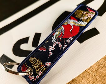 Llavero con etiqueta de vuelo "Grulla" "Buena suerte y felicidad"