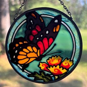 Atrapasol de mariposa monarca