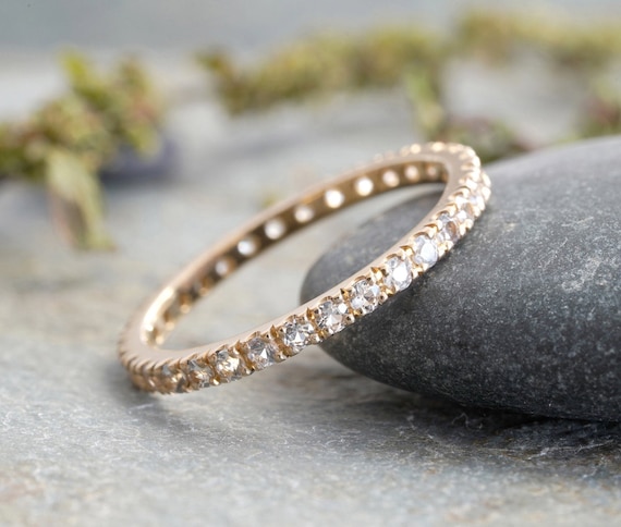 White sapphire eternity band yellow gold deals