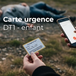 May include: A person holding a smartphone and a small card labeled "Carte urgence DT1 - enfant." The card is yellow with text. Another person is lying on the ground in the background.