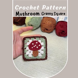 May include: Crochet pattern for a mushroom granny square. The square is made with red, white, green, and brown yarn. The mushroom is in the center of the square.