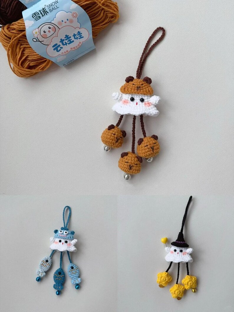 May include: Three handmade crochet ornaments. One features a white ghost-like figure with a brown bear hat and bear-shaped dangling accents. Another has a blue hat and fish accents. The third has a black witch hat and yellow accents.