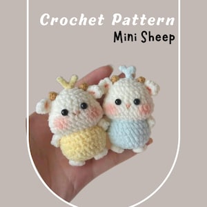 May include: Two crocheted mini sheep toys. One sheep is wearing a yellow body and the other is wearing a light blue body. Both have white heads, pink cheeks, and black eyes. The text "Crochet Pattern Mini Sheep" is at the top.