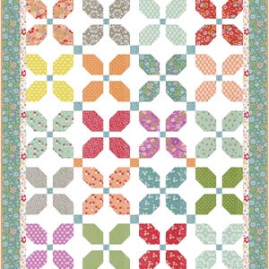 May include: A quilt pattern with a white background and a repeating pattern of colorful octagons arranged in a grid. The octagons are in shades of red, orange, yellow, green, blue, purple, and gray.