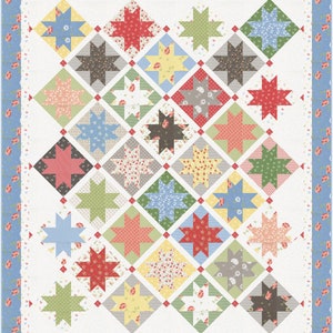 May include: A quilt with a white background and a pattern of colorful stars in a diamond shape. The stars are made of different fabrics with floral prints and solid colors. The quilt is bordered with a blue and white floral print.