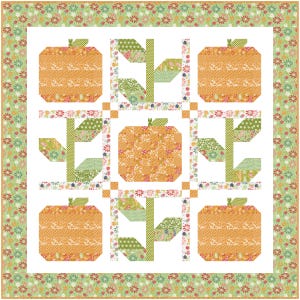 May include: A patchwork quilt with a white background and a repeating pattern of orange pumpkins with green stems and leaves. The pumpkins are surrounded by a green and white border with small floral designs.