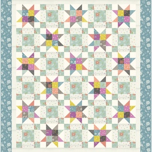 May include: A patchwork quilt with a variety of floral patterns in shades of blue, pink, yellow, and green. The quilt is made up of a grid of squares, each containing a star-shaped design. The quilt is surrounded by a border of blue and white floral fabric.