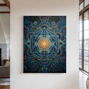 May include: A large, rectangular canvas print featuring a geometric design with a central star-like shape. The artwork uses a palette of blues, greens, and gold, creating a vibrant and intricate pattern. The print is displayed on a white wall in a well-lit room.