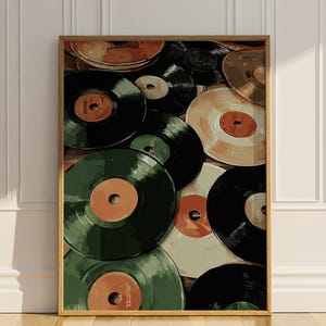 May include: A framed print depicting a collection of vintage vinyl records. The records are in various colours, including black, green, and tan, with orange and tan labels. The artwork has a warm, vintage aesthetic, suitable for music lovers and retro decor.