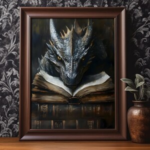 May include: A framed painting of a dragon reading a book. The dragon is blue and gray with a green eye. The book is open and has a brown leather cover. The background is a dark brown.