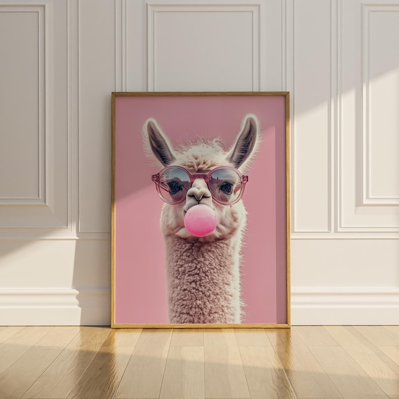 May include: A white llama wearing pink sunglasses and blowing a pink bubble. The llama is on a pink background.