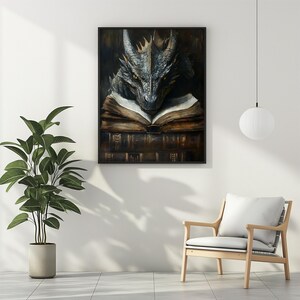 May include: A gray dragon with a book in its claws. The dragon is looking at the book. The book is open and has a brown leather cover. The dragon is sitting on a stack of books. The background is a dark brown color.