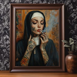 May include: Framed artwork featuring a nun with tattoos smoking a cigarette. The nun is wearing a black habit and a white wimple. Her arms are covered in tattoos, and she holds a cup. The artwork is in a brown frame.