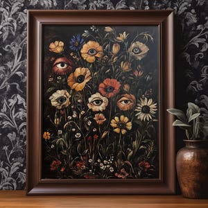 May include: A framed painting of a dark floral arrangement with flowers that have eyes. The flowers are in shades of yellow, orange, red, and white. The background is dark and the frame is brown.