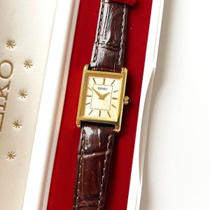 Nieuwe Seiko: horloge met gouden wijzerplaat, leren band, dozen, vintage ledi-horloge