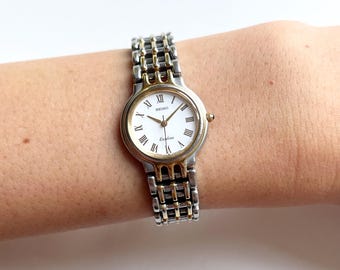 1990s Seiko Women's Gold Tone Dress Watch: Vintage Stainless