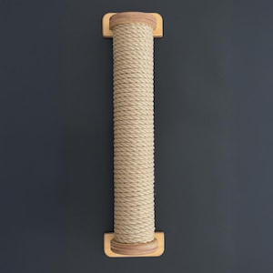 May include: A vertical cat scratching post with a beige rope-wrapped column. The column is attached to rectangular wooden bases at the top and bottom. The background is a solid dark gray.