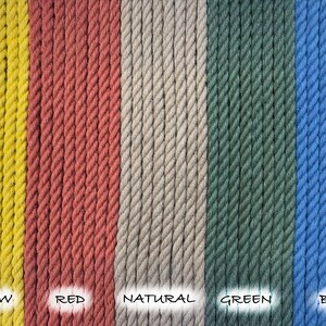 May include: Close-up of five different colored ropes, yellow, red, natural, green, and blue. The ropes are all the same thickness and are arranged in a row.