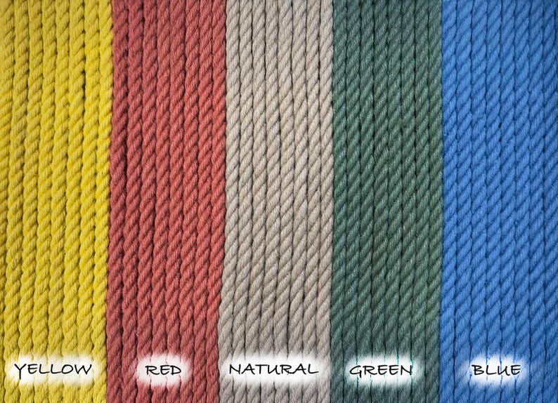 May include: Close-up of five different colored ropes, yellow, red, natural, green, and blue. The ropes are all the same thickness and are arranged in a row.