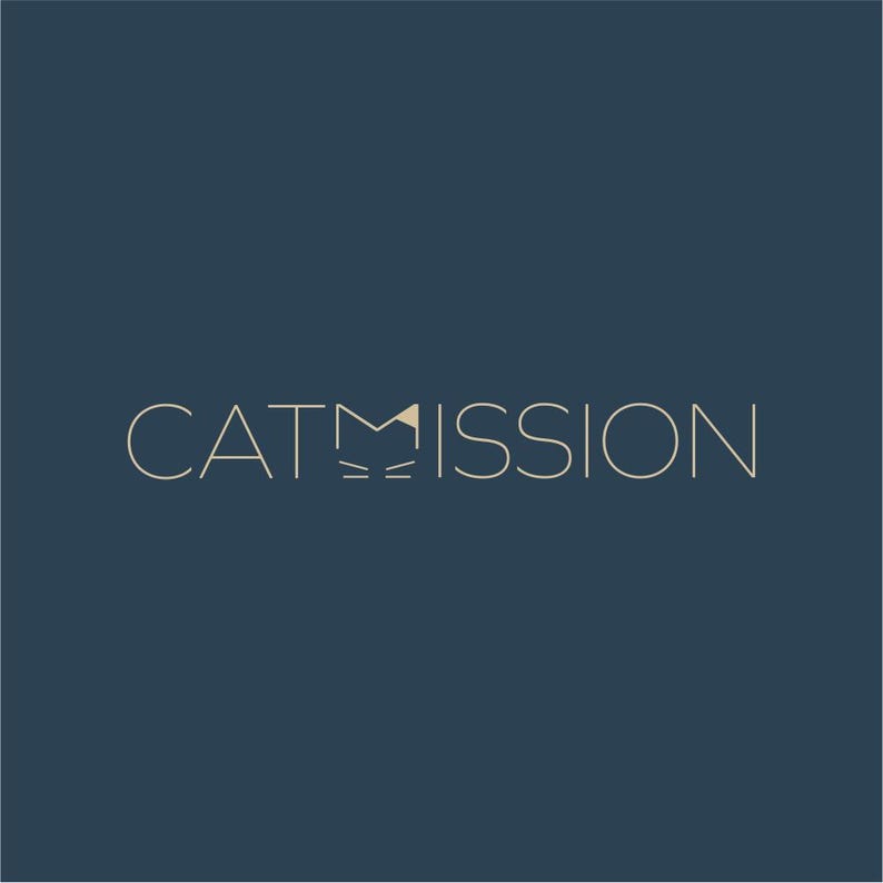 May include: A logo with the word "CATMISSION" in a light beige color on a dark blue background. The "M" in the word is stylized to look like a cat's face.