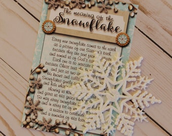 May include: A white card with blue and brown accents features a snowflake design and text that reads "The meaning of the snowflake." The text explains that each snowflake is a reminder of God's care and love.