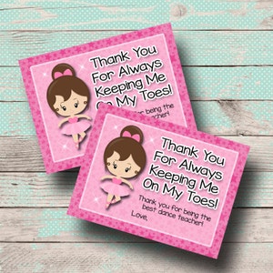 May include: Pink thank you card with a cartoon ballerina and the text "Thank You For Always Keeping Me On My Toes! Thank you for being the best dance teacher! Love,"