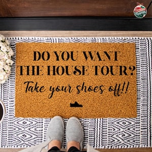 May include: A handmade wooden sign with the text "Welcome" in a playful font. The sign features a distressed, rustic finish and a simple, inviting design, perfect for a front door or entryway.