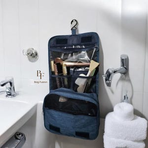 Trousse de toilette suspendue Trousse de toilette personnalisée Trousse de maquillage Trousse de toilette de voyage imperméable de grande capacité avec crochet zippé en nylon PU