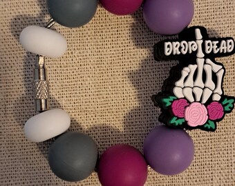 Dije de taza de Drop Dead