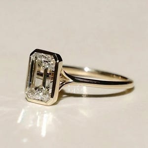 4.00 CT Emerald Cut Moissanite Engagement Ring: Bezel Set Solid Gold
