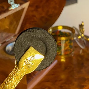 Golden tongs for charcoal and traditional incense