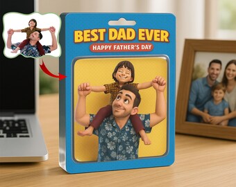 May include: A blue and yellow box with the words "BEST DAD EVER" and "HAPPY FATHER'S DAY". Inside is a 3D rendering of a father carrying his child on his shoulders. A family photo is in a wooden frame.