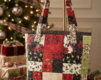 May include: A quilted tote bag featuring a patchwork design of various holiday-themed fabrics in shades of red, black, white, and green. The bag has two matching fabric handles and a rectangular structure with a repeating pattern of poinsettias.