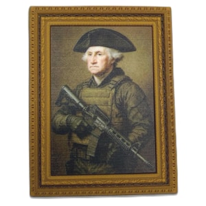 May include: A framed print featuring a portrait of George Washington in a military vest and holding a rifle. The portrait is in a gold-colored ornate frame. The image has a vintage, aged appearance.