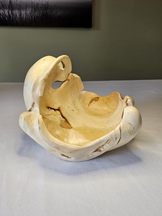 Maple burl means every single bowl is a one-of-a-kind swirling wood galaxy — no two are alike, and the natural live-edge form does all the design work.