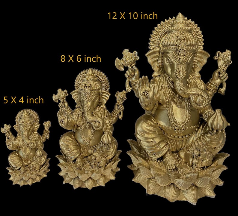 May include: Three gold-colored Ganesha statues of varying sizes, each sitting on a lotus base. The statues are 5 x 4 inches, 8 x 6 inches, and 12 x 10 inches.