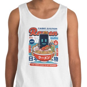 May include: White tank top featuring a colorful graphic of a bowl of ramen with a robot face. The design includes Japanese text and the words "Cabin System Ramen". The tank top is made of a soft, comfortable material.