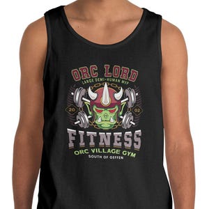 May include: Black tank top with a graphic featuring an orc-themed design. The design includes the text "Orc Lord" and "Fitness," along with an orc face and barbells. The tank top is worn by a person.