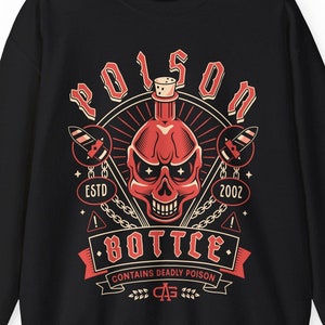 May include: Black sweatshirt with a red and white graphic design of a skull with a bottle of poison. The graphic includes the text "Poison Bottle" and "Contains Deadly Poison".