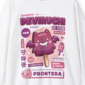 May include: White sweatshirt with a pink and purple graphic design featuring a cartoon bat-shaped ice cream with the text "Sweet DEVIRUCHI" and "PRONTERA".