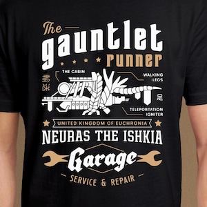 May include: Black t-shirt with a white graphic design of a futuristic vehicle with the text "The Gauntlet Runner", "United Kingdom of Euchronia", "Neuras the Ishkia", and "Garage Service & Repair".