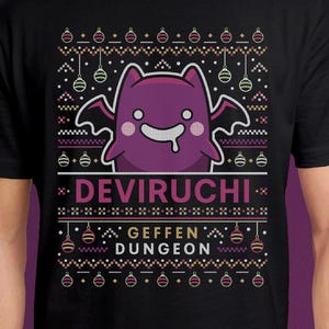 May include: Black t-shirt featuring a purple cartoon bat-like creature with the text "DEVIRUCHI" and "GEFFEN DUNGEON" in a festive, pixelated design. The design includes hanging ornaments and a repeating pattern, resembling a holiday sweater.