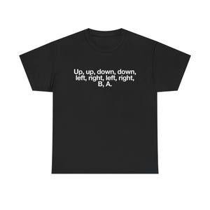 May include: Black t-shirt with white text that reads "Up, up, down, down, left, right, left, right, B, A."