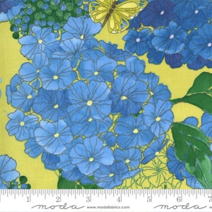 May include: Fabric with a floral pattern featuring large blue hydrangea blooms and a yellow butterfly against a yellow-green background. Green leaves and stems are also visible. The fabric has a ruler printed along the bottom edge.