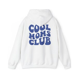 May include: White hooded sweatshirt with a blue "COOL MOMS CLUB" graphic on the back.