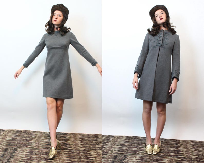 May include: Two images side-by-side of a woman wearing a gray dress and a matching hat. The dress is long-sleeved and knee-length. The woman is also wearing gold shoes. The dress on the right has buttons down the front.